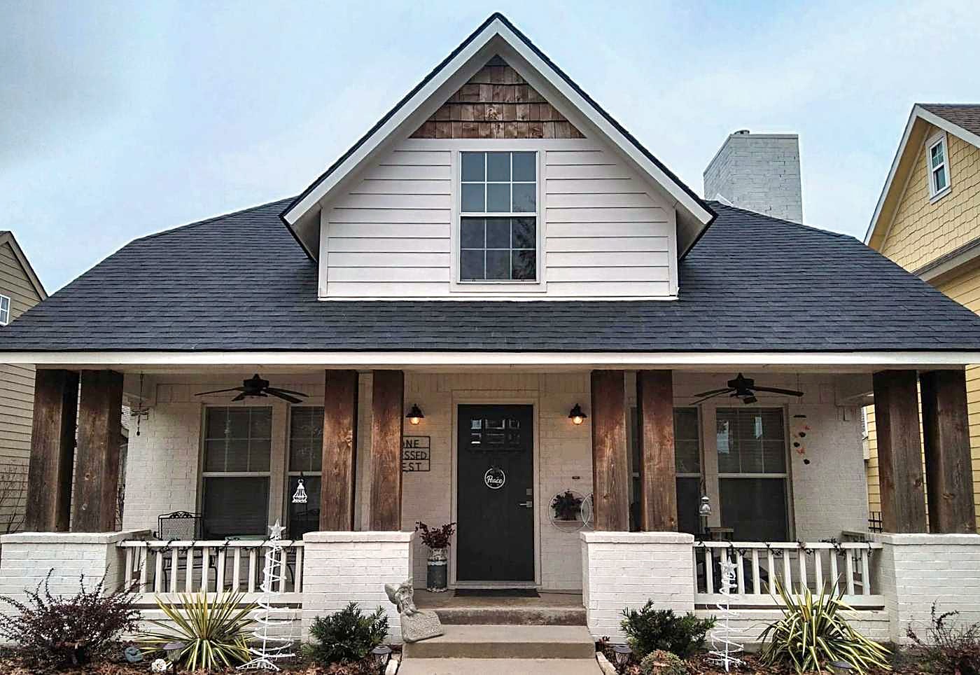 A white farmhouse in Midlothian with a new architectural shingle roof
